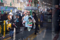 An Iranian woman carries a picture of Iran's Supreme Leader Ayatollah Ali Khamenei during a ceremony to mark the 40th anniversary of the Islamic Revolution in Tehran, Iran February 11, 2019. Masoud Shahrestani/Tasnim News Agency/via REUTERS