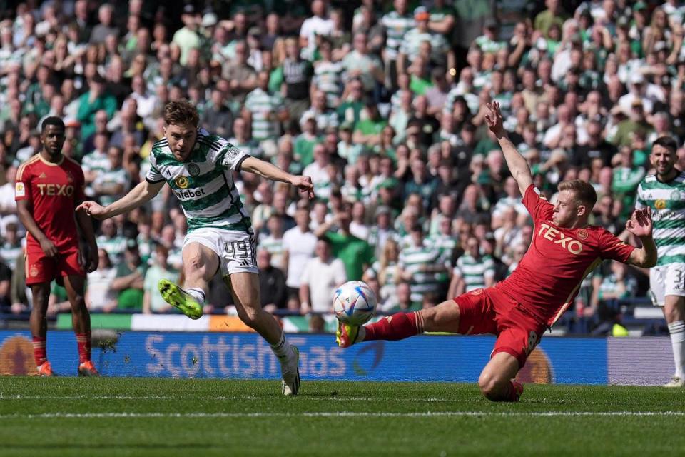 Celtic winger James Forrest curls his team into the lead against Aberdeen at Hampden. <i>(Image: Agency)</i>