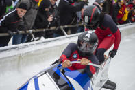 Elana Meyers Taylor, front, and Lake Kwaza, from the United States compete during the during their first run of the women's bobsled World Cup race in Winterberg, Germany, Saturday, Dec. 15, 2018. (Christophe Gateau/dpa via AP)