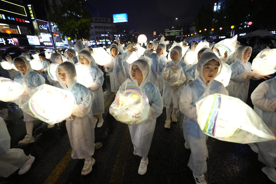 Young Buddhists carry lanterns and participate in a parade during the Lotus Lantern Festival, ahead of the birthday of Buddha at Dongguk University in Seoul, South Korea, Saturday, May 11, 2024. (AP Photo/Ahn Young-joon)
