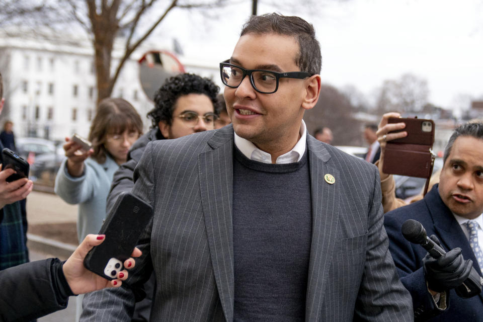 FILE — Rep. George Santos, R-N.Y., leaves a House GOP conference meeting on Capitol Hill, in Washington, Jan. 25, 2023. Santos is carrying on in Congress despite calls for him to resign. Santos admitted to fabricating many aspects of his life story, but the newly elected congressman is refusing calls to quit. (AP Photo/Andrew Harnik, File)