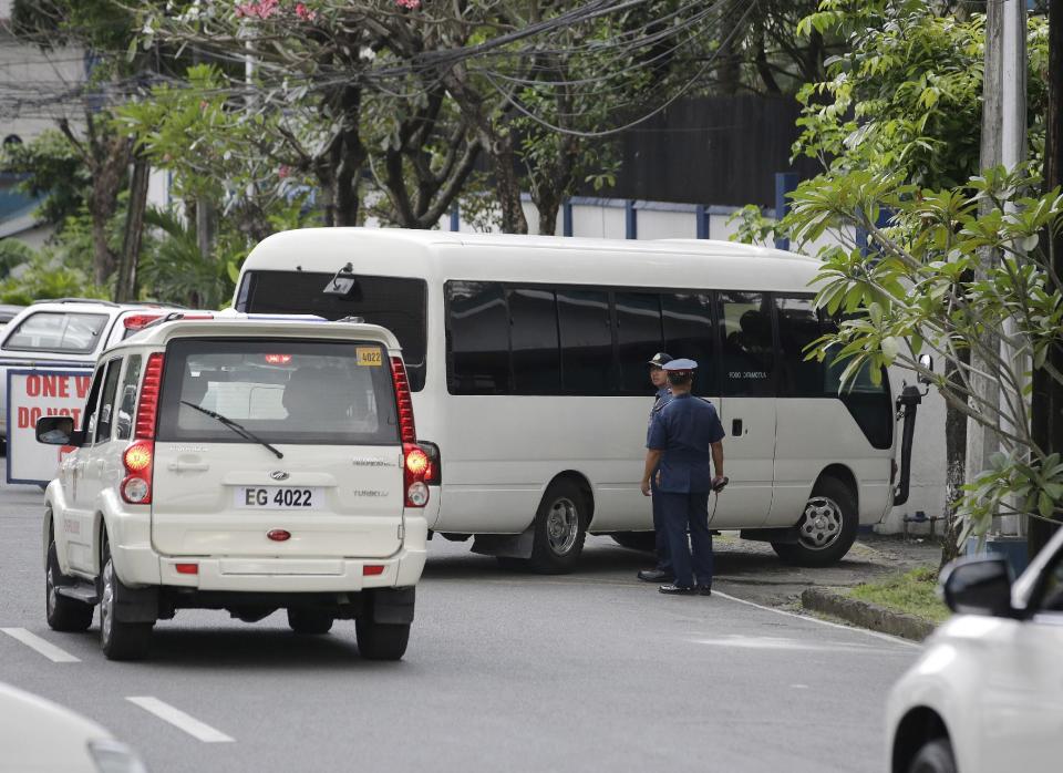 A van carrying arrested Senator Leila De Lima enters the Philippine National Police Custodial Center at Camp Crame, Quezon city, north of Manila, Philippines on Friday, Feb. 24, 2017. Opposition senator De Lima and leading critic of President Rodrigo Duterte's deadly anti-drug crackdown was arrested Friday on drug charges but professed her innocence and vowed she would not be intimidated by a leader she called a "serial killer."(AP Photo/Aaron Favila)