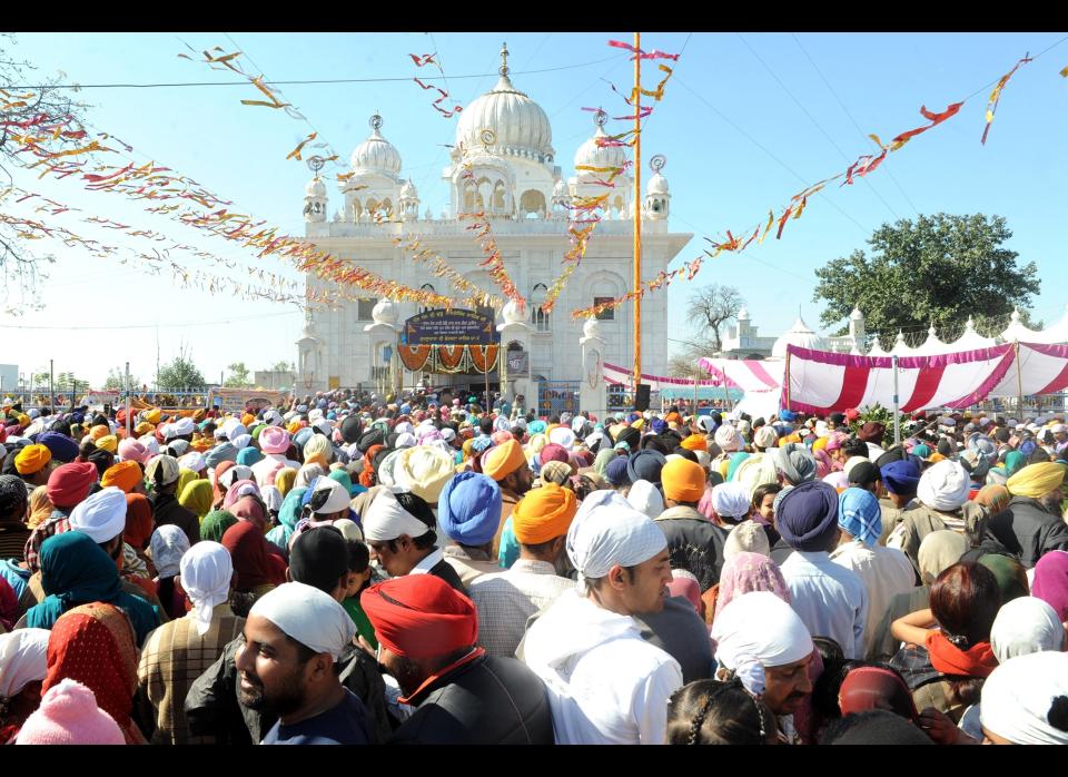 Indian Sikh devotees pay their respects at the Sikh Shrine Gurdwara Chheharta Sahib on the occasion of Basant Panchami.