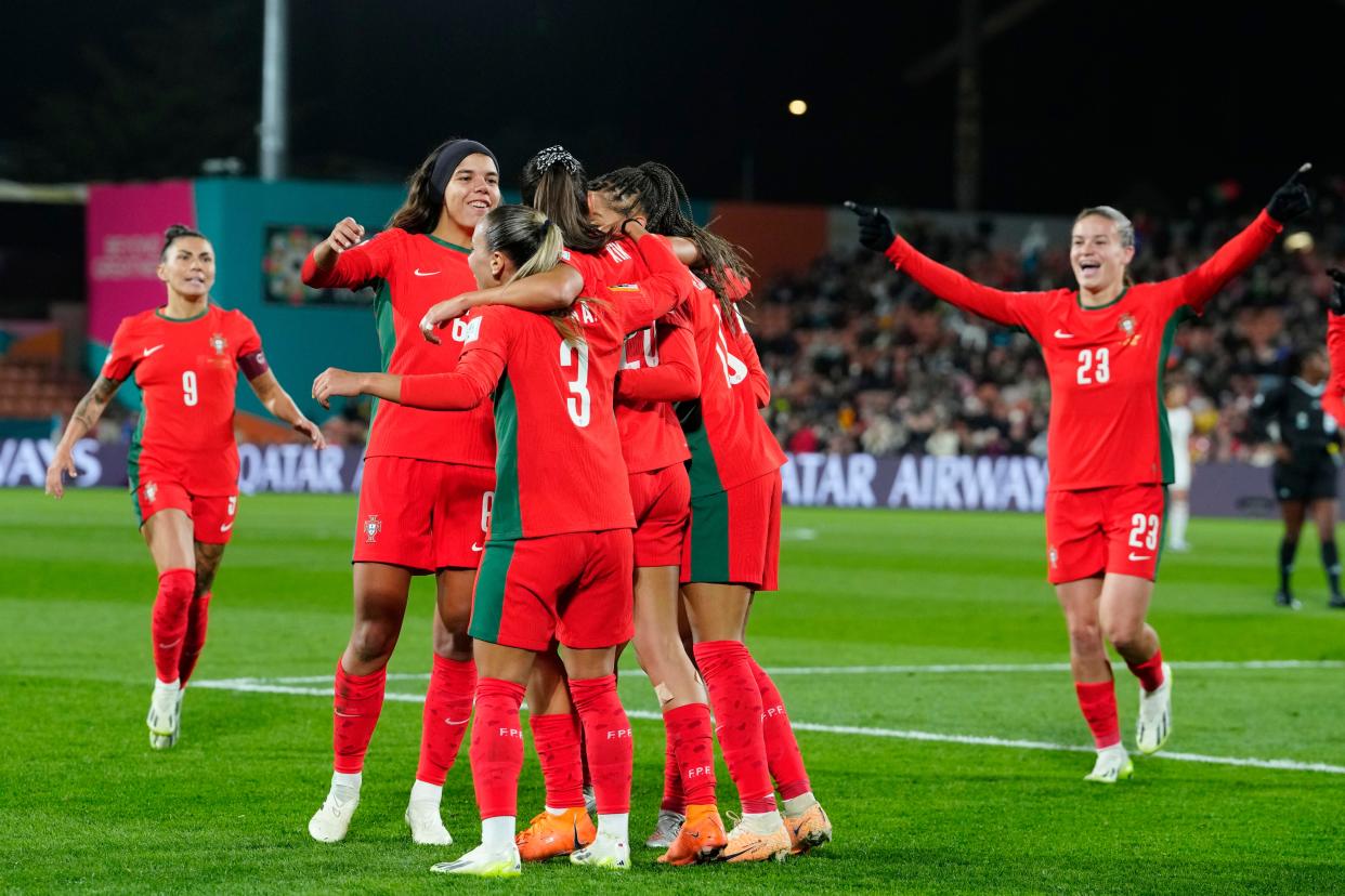 Portugal's Kika Nazareth celebrates with teammates after scoring her side's 2nd goal during the Women's World Cup Group E soccer match between Portugal and Vietnam in Hamilton, New Zealand, Thursday, July 27, 2023. (AP Photo/Abbie Parr)