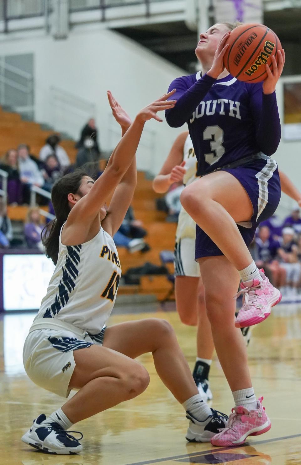 Bloomington South’s Carlie Pedersen (3) drives to the basket against Mooresville’s Sydney Hardy (10) during their IHSAA girls’ basketball sectional first round game at South on Tuesday, Jan. 31, 2023.