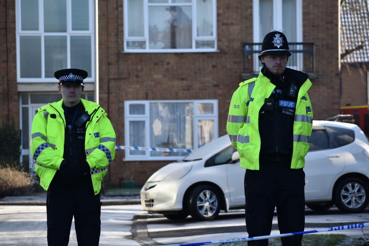 Police officers at the scene in Kettering, Northamptonshire where a woman and two children were murdered. Officers were called to Petherton Court at around 11.15am on Thursday where they found the woman and a boy and girl, with serious injuries. The woman died at the scene despite treatment from paramedics and the two children died later in hospital. A man has been arrested on suspicion of murder following the deaths. Picture date: Friday December 16, 2022. (PA Wire)