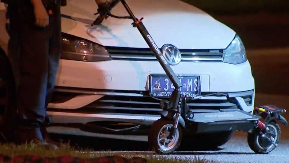 An e-scooter seen smashed in front of a Volkswagen after a fatal crash in Narre Warren.