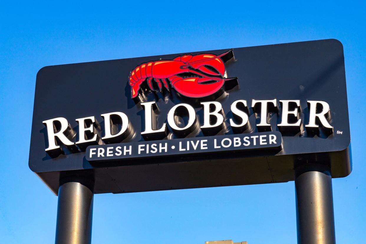 Sign of a Red Lobster seafood restaurant in Harrisburg, Pennsylvania against a clear, blue sky