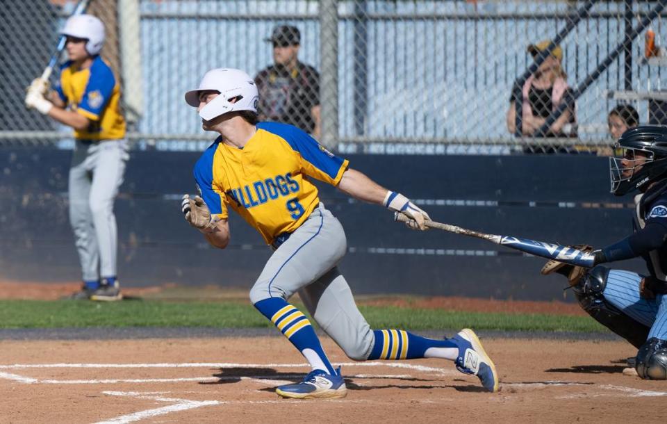 Turlock’s Carter Crivelli drives a single during the Central California Athletic League game with Downey at Downey High School in Modesto, Calif., Friday, April 12, 2024.