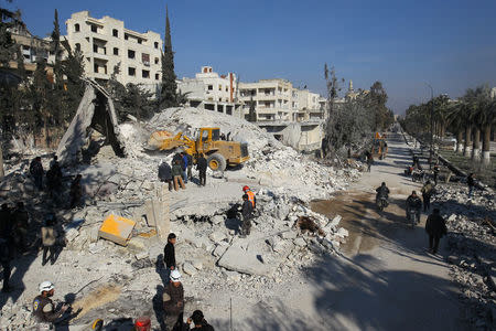 People inspect the damage at a site hit by airstrikes in the rebel-held city of Idlib, Syria February 7, 2017. REUTERS/Ammar Abdullah