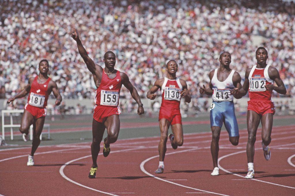 Ben Johnson celebrates winning gold in the men's 100m at the 1988 Olympics