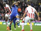 <p>Chelsea’s Diego Costa, centre, battles for the ball with Stoke’s Bruno Martins Indi, left, and Erik Pieters during the English Premier League soccer match between Stoke City and Chelsea at the Britannia Stadium, Stoke on Trent, England, Saturday, March 18, 2017. (AP Photo/Rui Vieira) </p>