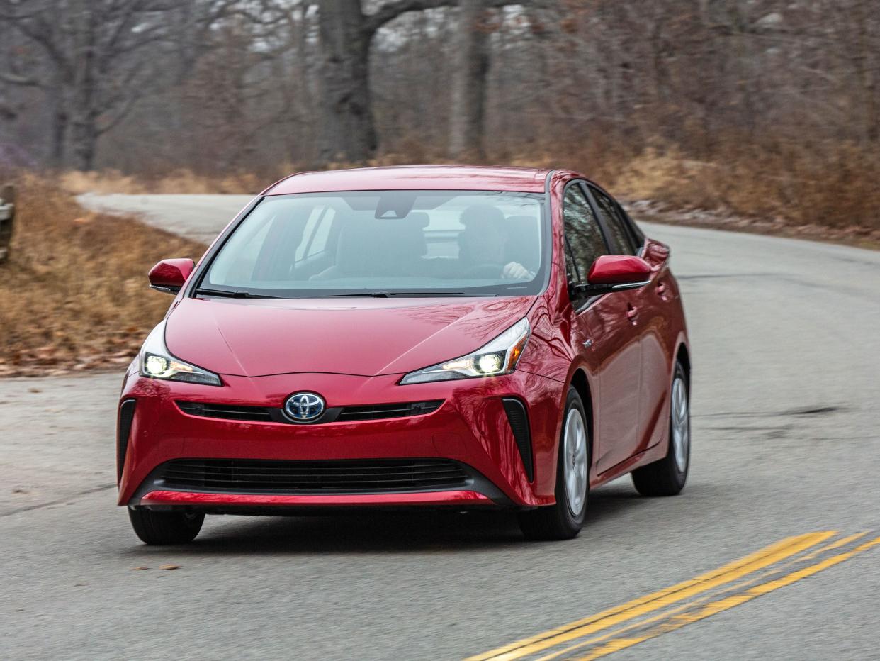 Red 2020 Toyota Prius LE on road