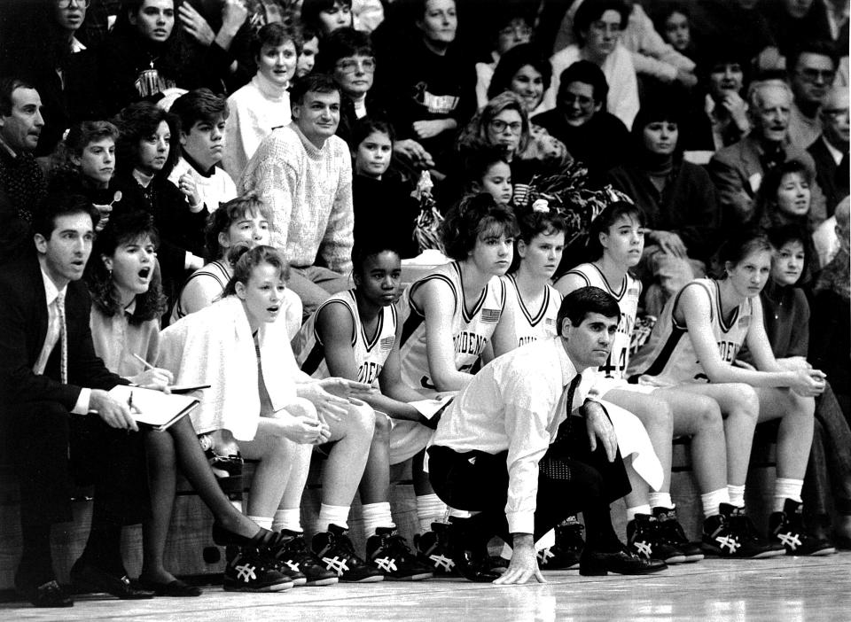 Providence College women's basketball coach Bob Foley on the sidelines with his team. Foley coached at Providence from 1985-96 and collected 206 career wins.