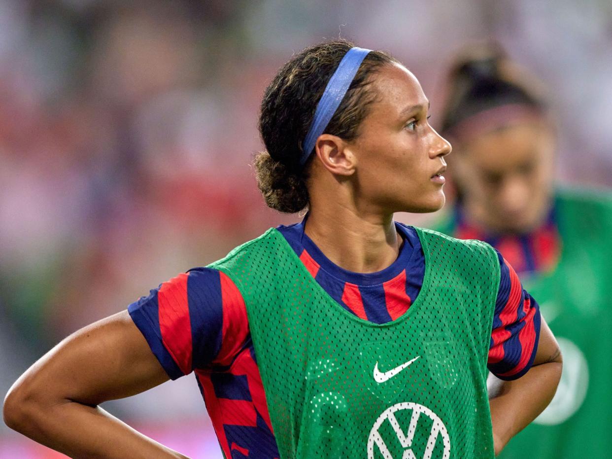 Lynn Williams waits for a USWNT substitution.