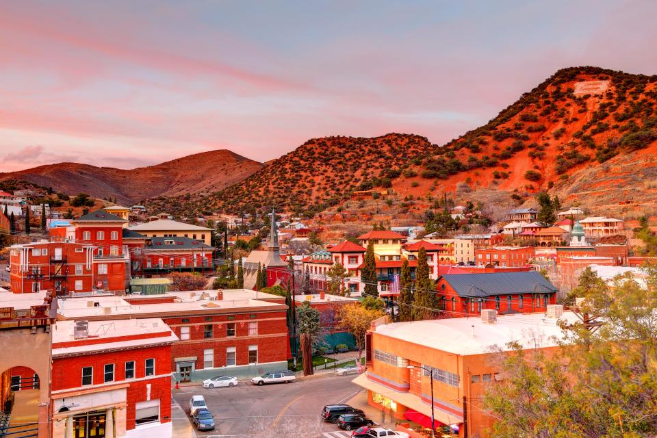 Bisbee skyline in front of mountains at sunset