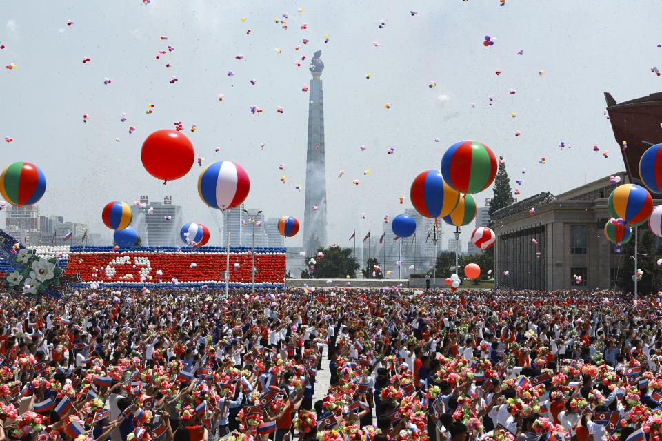 North Korea's people attend the official welcome ceremony with Russian President Vladimir Putin and North Korea's leader Kim Jong Un in the Kim Il Sung Square in Pyongyang, North Korea, on Wednesday, June 19, 2024. (Vladimir Smirnov, Sputnik, Kremlin Pool Photo via AP)