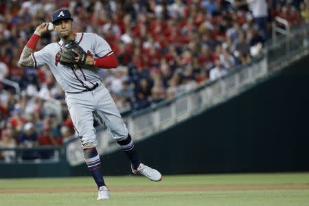 Jul 20, 2018; Washington, DC, USA; Atlanta Braves third baseman Johan Camargo (17) makes a throw to first base on a ground ball by Washington Nationals center fielder Adam Eaton (not pictured) in the seventh inning at Nationals Park. Mandatory Credit: Geoff Burke-USA TODAY Sports