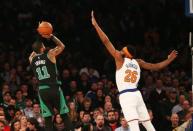 Feb 1, 2019; New York, NY, USA; Boston Celtics guard Kyrie Irving (11) shoots the ball over New York Knicks center Mitchell Robinson (26) during the first half at Madison Square Garden. Mandatory Credit: Andy Marlin-USA TODAY Sports