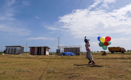 A Rohingya child plays with balloons at a temporary shelter in Kuala Cangkoi, Lhoksukon, Aceh province, Indonesia June 2, 2015 in this photo taken by Antara Foto. REUTERS/Zabur Karuru/Antara Foto