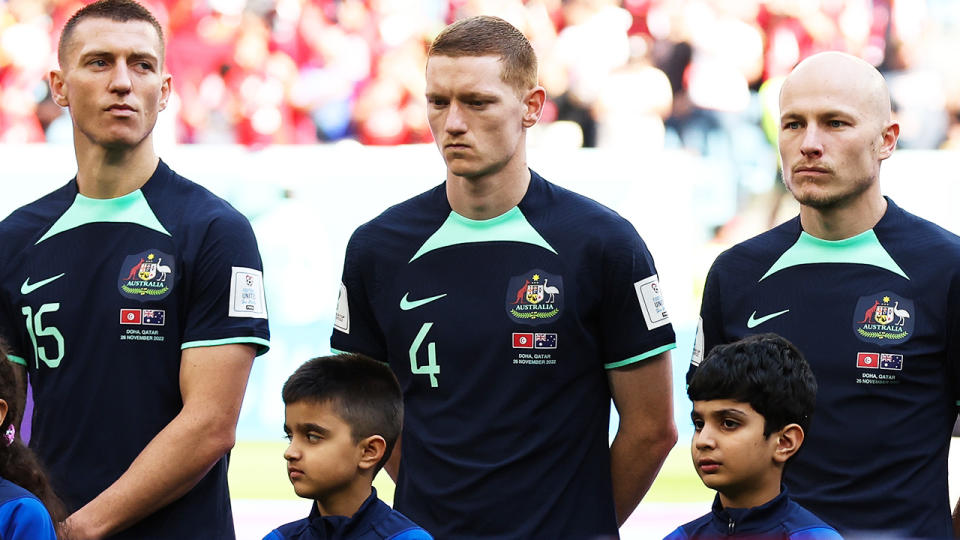 Socceroos players, pictured here singing the national anthem ahead of their clash with Tunisia at the World Cup.