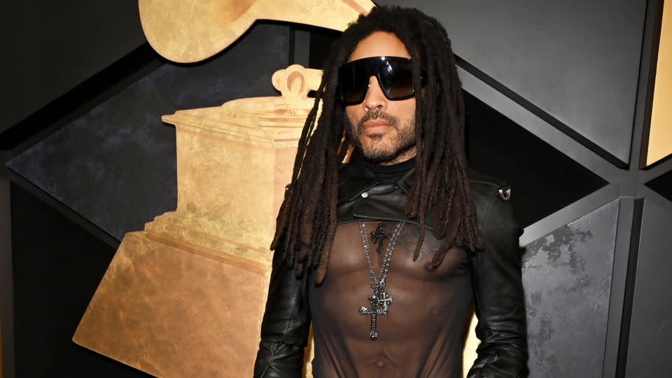 Lenny Kravitz went full rockstar in a leather crop jacket, sheer black top and pants paired with several silver cross necklaces. - Lester Cohen/Getty Images