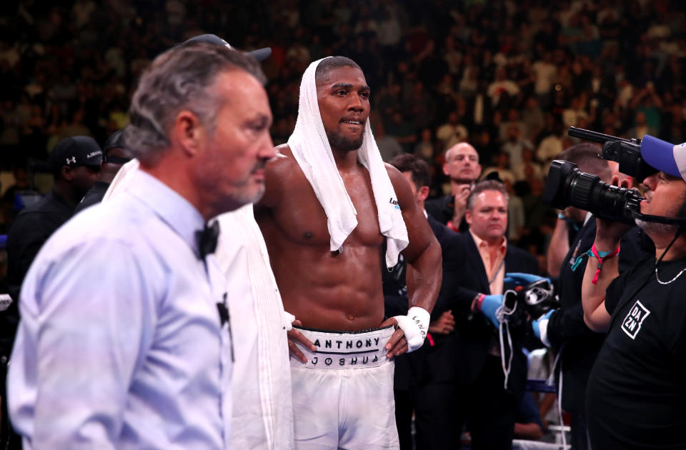 Anthony Joshua (centre) appears dejected after losing to Andy Ruiz Jr in the WBA, IBF, WBO and IBO Heavyweight World Championship match at Madison Square Garden, New York. (Photo by Nick Potts/PA Images via Getty Images)