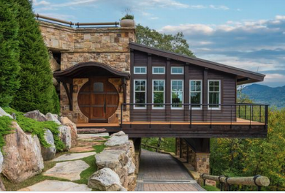 The 5.6-acre Lazy Bear Lodge estate has a separate 3,000-square-foot party pavilion and a “Hobbit-esque” guest house.