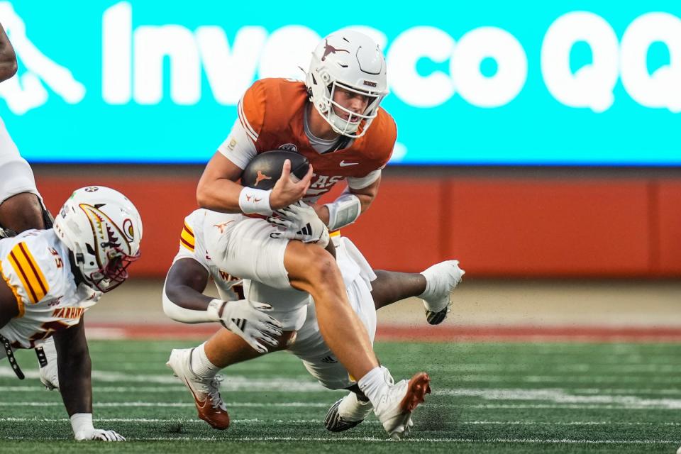 Texas quarterback Arch Manning runs the ball as the Texas Longhorns take on ULM at Royal-Memorial Stadium in Austin on Saturday.