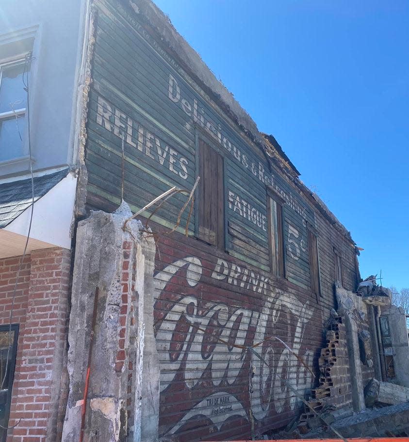 A Coca-Cola advertisement was discovered on the exterior wall of a building at 22 Third Ave., in Long Branch, after an adjacent building was torn down.