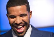 Rapper Drake smiles during an announcement that the Toronto Raptors will host the NBA All-Star game in Toronto, September 30, 2013. Toronto was selected as the host of the National Basketball Association's (NBA) 2016 All-Star Game, marking the first time the showcase event will be held outside of the United States, the league said on Monday. REUTERS/Mark Blinch (CANADA - Tags: SPORT BASKETBALL ENTERTAINMENT)