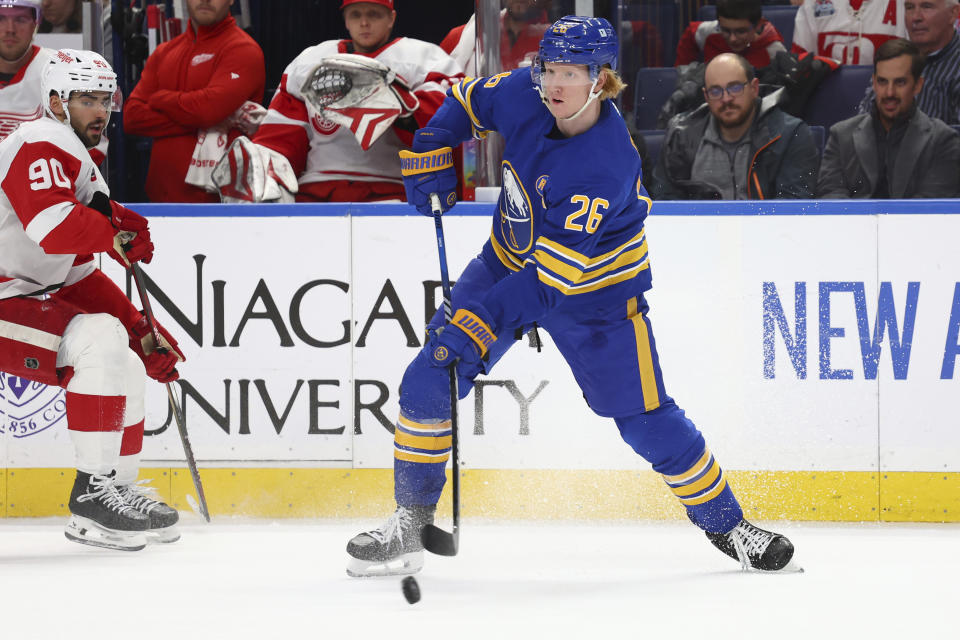 Buffalo Sabres defenseman Rasmus Dahlin (26) passes the puck during the second period of an NHL hockey game against the Detroit Red Wings Tuesday, Dec. 5, 2023, in Buffalo, N.Y. (AP Photo/Jeffrey T. Barnes)