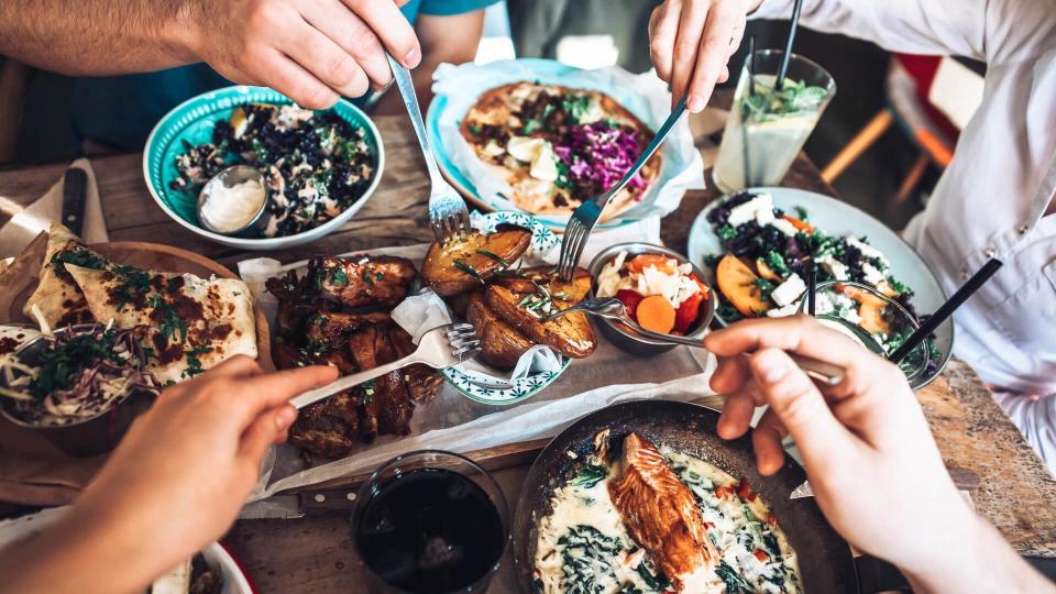 Happy people sharing their healthy lunch.