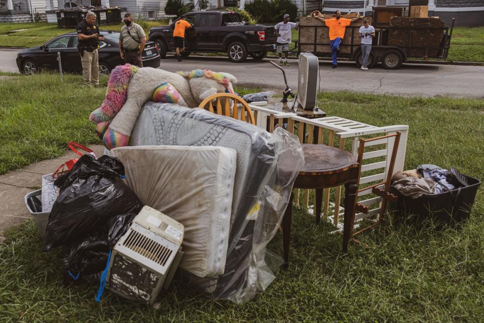 Items sit piled in a front yard in the west end as members of the Sheriff's Department enforce evictions following the moratorium being lifted. Sept. 8, 2021