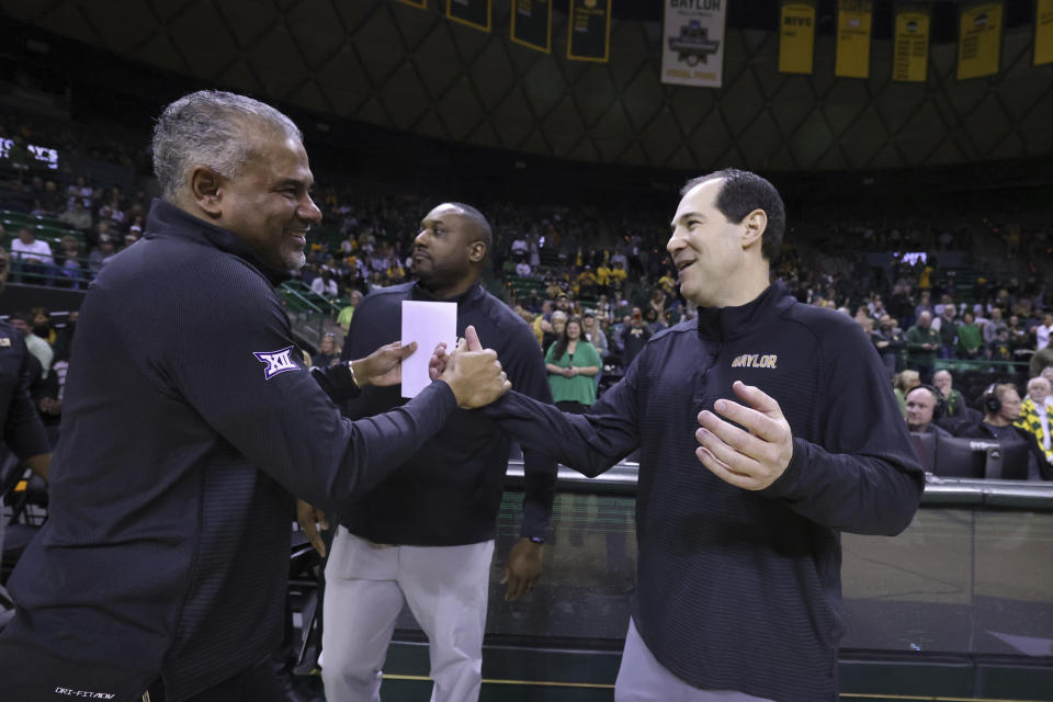 Kansas State head coach Jerome Tang, left, shakes hands with Baylor head coach Scott Drew before their NCAA college basketball game, Saturday, Jan. 7, 2023, in Waco, Texas. Tang was a long-time coach with Baylor before moving on to Kansas State. (AP Photo/Rod Aydelotte)