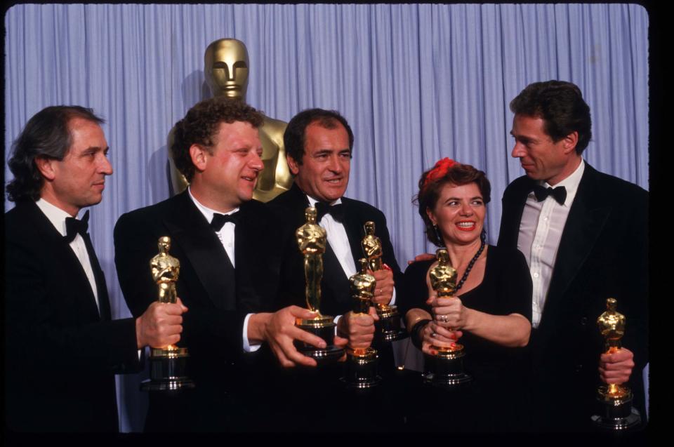 049944 37: From right to left, The creative team behind the Best Picture Oscar 