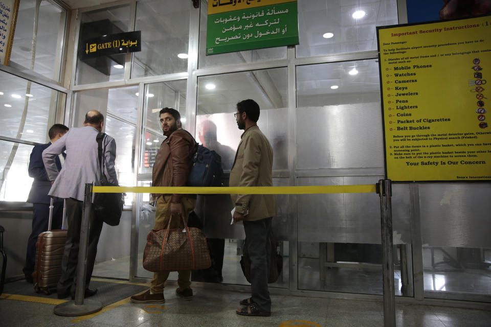 Yemenis queue at the departure lounge to board the first commercial flight at Sanaa airport, Yemen, Monday, May, 16, 2022. The first commercial flight in six years took off from Yemen’s rebel-held capital on Monday, officials said, part of a fragile truce in the county’s grinding civil war.(AP Photo/Hani Mohammed)