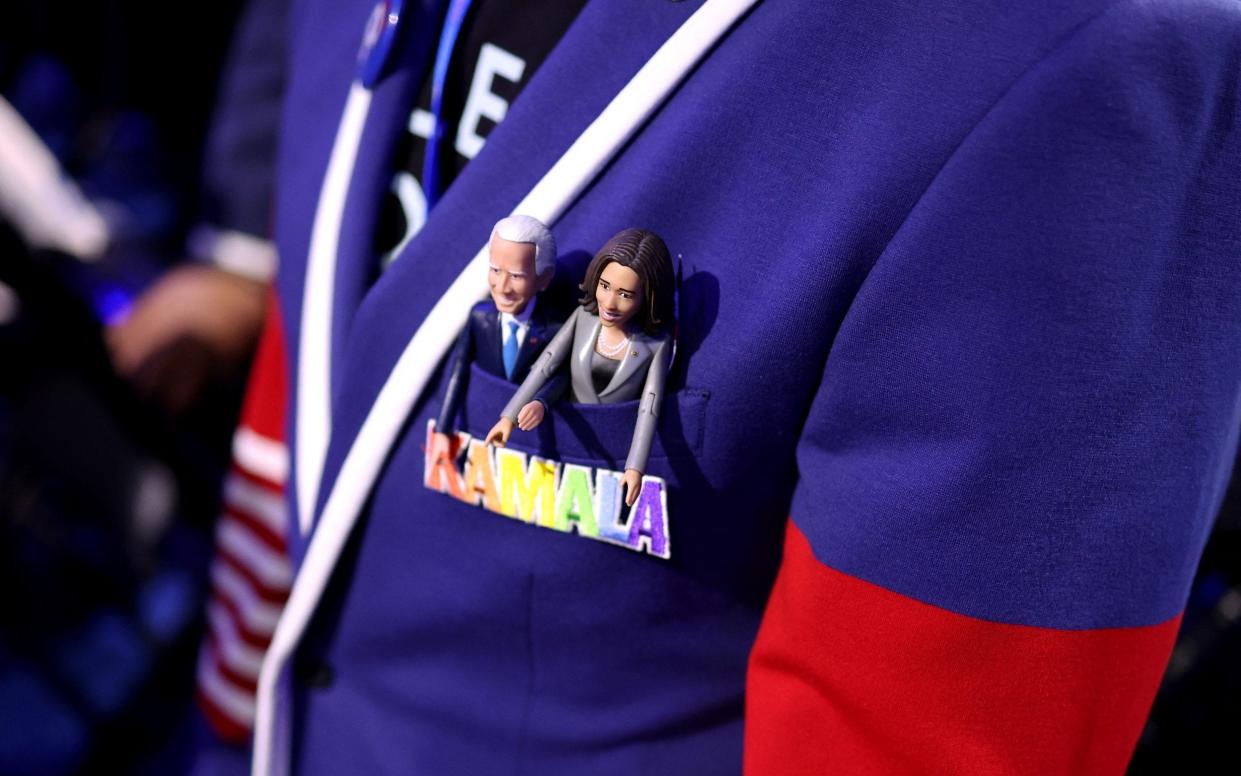 Joe Biden and Kamala Harris are pictured inside the pocket of the jacket of a California delegate on the first day of the Democratic National Convention