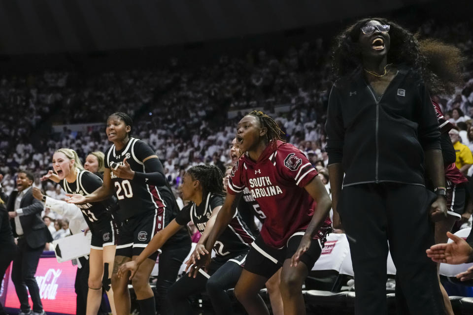 The South Carolina bench reacts in the final moments in the second half an NCAA college basketball game against LSU in Baton Rouge, La., Thursday, Jan. 25, 2024. South Carolina won 76-70. (AP Photo/Gerald Herbert)