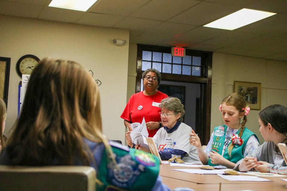 Ramona Malone and Ann Zimmerman (center) instruct Girl Scouts on various activities throughout the day.