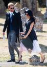 <p>For the wedding of Harry's friend Charlie van Straubenzee, Meghan opted for a navy <a href="https://www.cosmopolitan.com/uk/reports/a22646840/meghan-markle-bra-flash/" rel="nofollow noopener" target="_blank" data-ylk="slk:Club Monaco dress;elm:context_link;itc:0;sec:content-canvas" class="link ">Club Monaco dress</a> with green, white and pink accents. The Duchess paired her look with a Philip Treacy hat and Aquazzura shoes.</p>