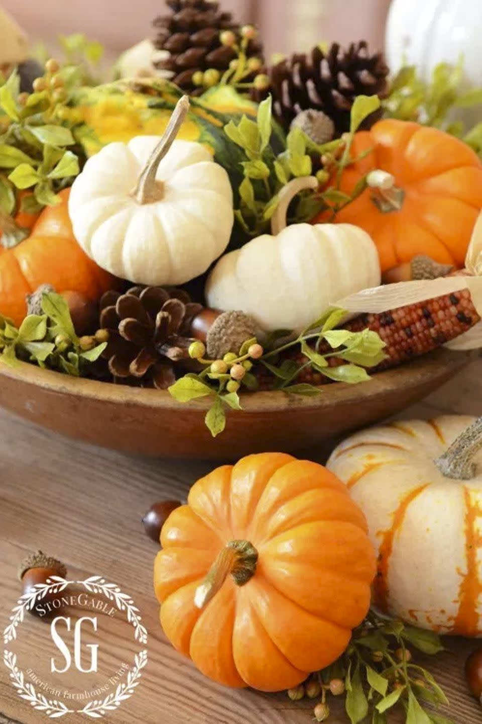 <p>Fill a rustic wooden bowl with all these fall staples just before your guests arrive. </p><p><strong>Get the tutorial at <a rel="nofollow noopener" href="http://www.stonegableblog.com/5-minute-fall-decor-diy/" target="_blank" data-ylk="slk:Stone Gable;elm:context_link;itc:0;sec:content-canvas" class="link ">Stone Gable</a>.</strong></p>