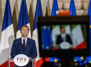 French President Emmanuel Macron, left, listens to Italian Premier Mario Draghi during a joint press conference at Villa Madama in Rome, Friday, Nov. 26, 2021, after signing the Quirinale Treaty between Italy and France, which aims to provide a stable and formalized framework for cooperation in relations between the two countries. (AP Photo/Domenico Stinellis, Pool)