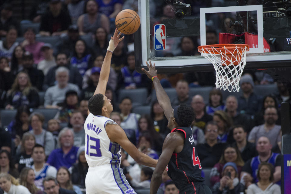 Sacramento Kings forward Keegan Murray (13) is guarded by Toronto Raptors forward Pascal Siakam during the first quarter of an NBA basketball game in Sacramento, Calif., Wednesday, Jan. 25, 2023. (AP Photo/Randall Benton)