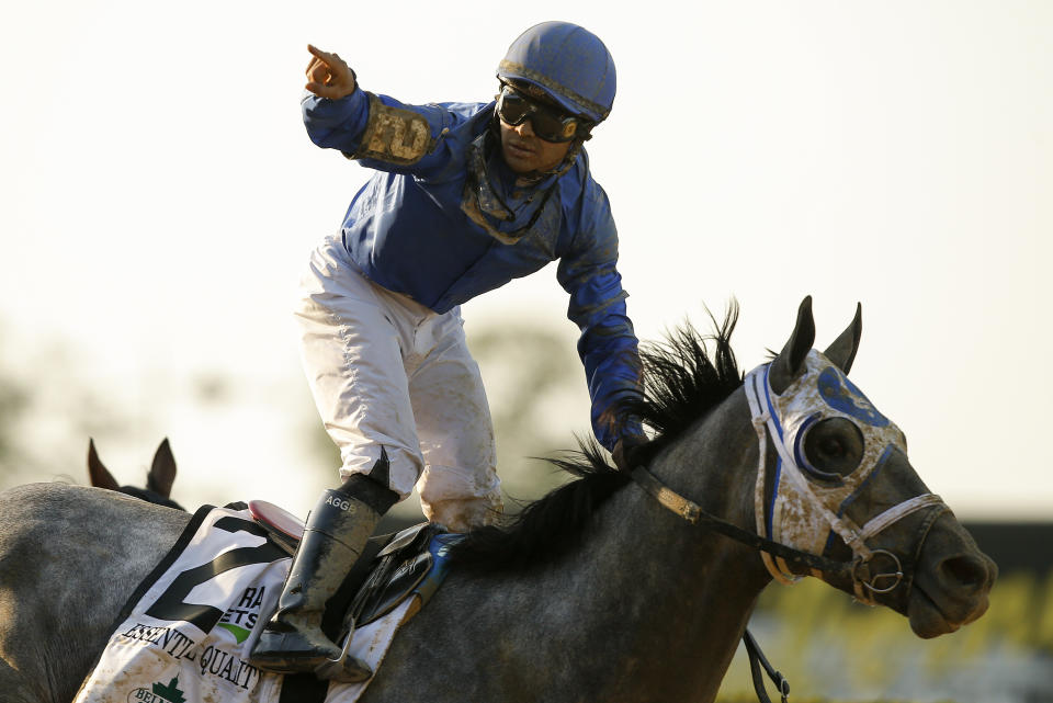 Jockey Luis Saez reacts after crossing the finish line atop Essential Quality (2) to win the 153rd running of the Belmont Stakes horse race, Saturday, June 5, 2021, At Belmont Park in Elmont, N.Y. (AP Photo/Eduardo Munoz Alvarez)