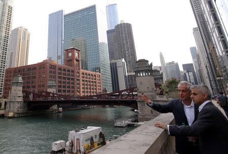 Mayor of London Sadiq Khan (R) looks out over the Chicago River during a tour with Mayor of Chicago Rahm Emanuel in Chicago, Illinois, U.S. September 16, 2016. REUTERS/Jim Young