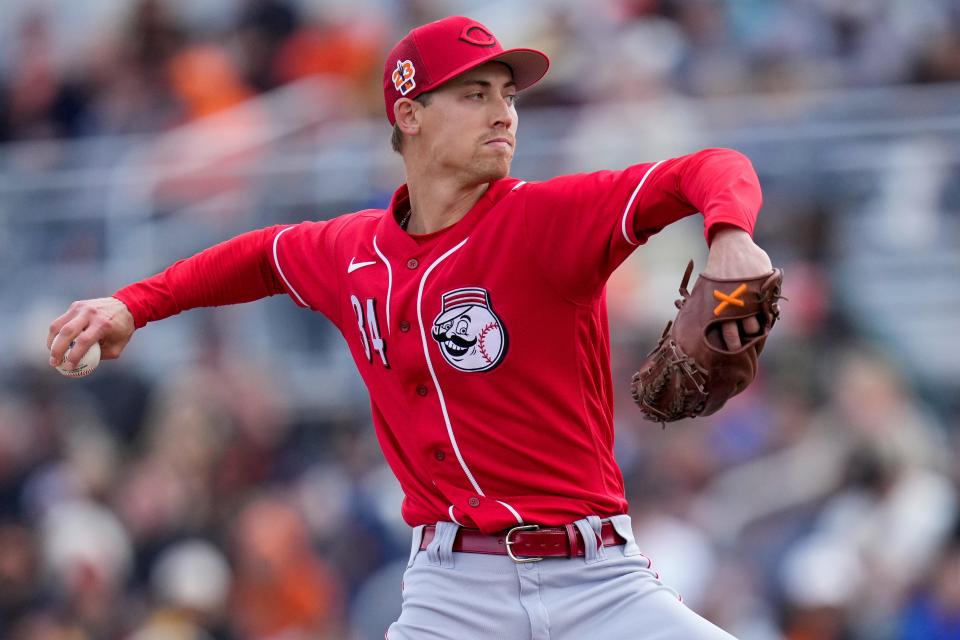 Cincinnati Reds relief pitcher Luke Weaver (34) throws a pitch in the first inning of the MLB Cactus League spring training game between the San Francisco Giants and the Cincinnati Reds at Scottsdale Stadium in Goodyear, Ariz., on Sunday, Feb. 26, 2023. The Giants came back in the ninth inning to win on a walk-off single off the bat of Will Wilson.