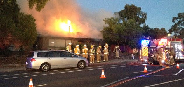 Fire crews tackle the house fire at Flagstaff Hill this morning. Photo: Jeff Anderson
