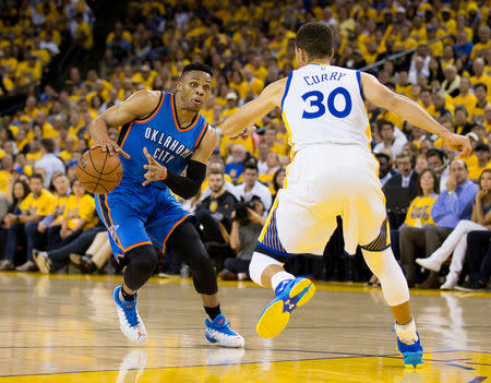 Oklahoma City Thunder Russell Westbrook dribbles as Golden State Warriors Stephen Curry defends in game five. Kelley L Cox-USA TODAY Sports