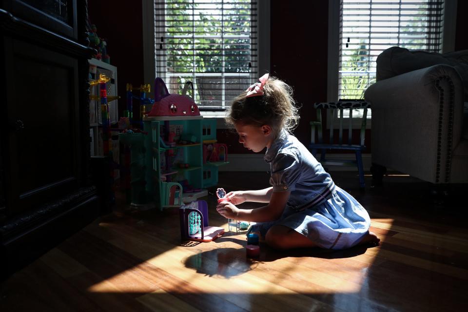 Emma Trendowski, 5, plays with toys in the living room of her Crown Point home Wednesday, August 4, 2021. Emma was born at 30 weeks in 2016, due to her mother Stephanie Trendowski's preeclampsia complications. 